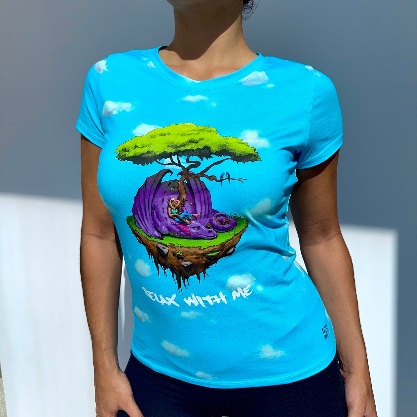 Person wearing a blue t-shirt with a colorful graphic design and 'Relax With Me' text.