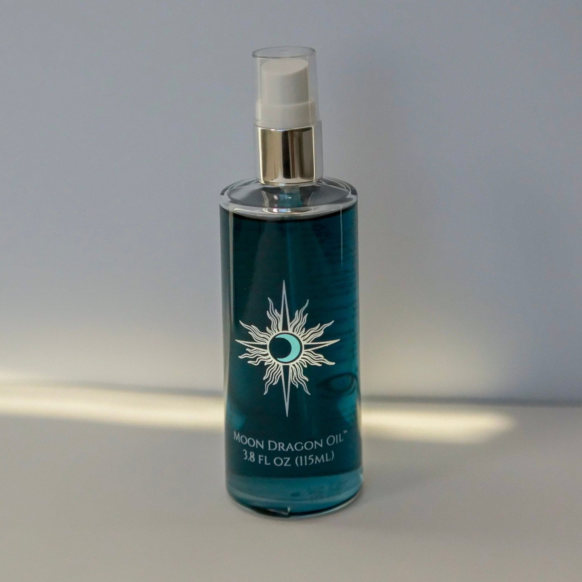 Blue bottle with a star-like design on a gray background